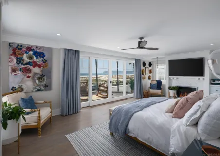 a large bedroom with a bed and a couch