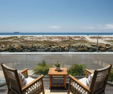 an outdoor sitting area with lake view