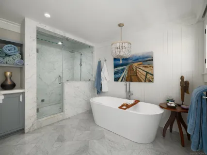 a bathroom with a sink a tub and a shower