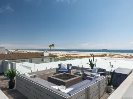 a view of a patio with table and chairs