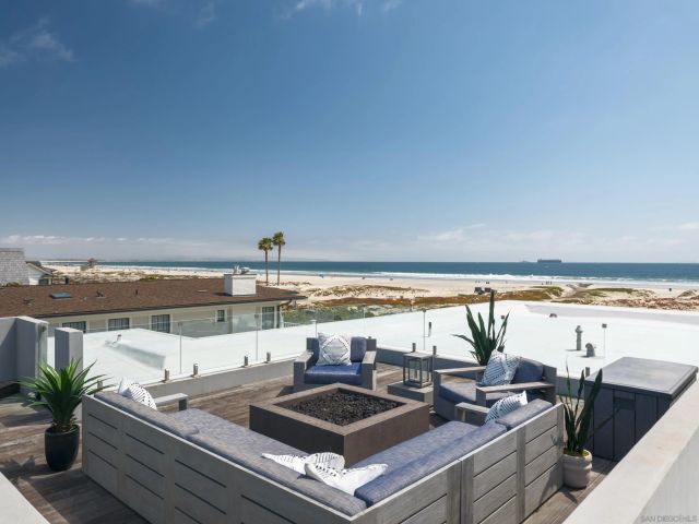 a view of a patio with table and chairs