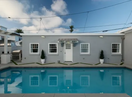 a kitchen with sink stove and refrigerator