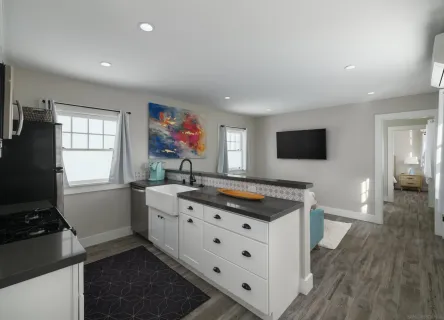 a bathroom with a toilet a sink and shower