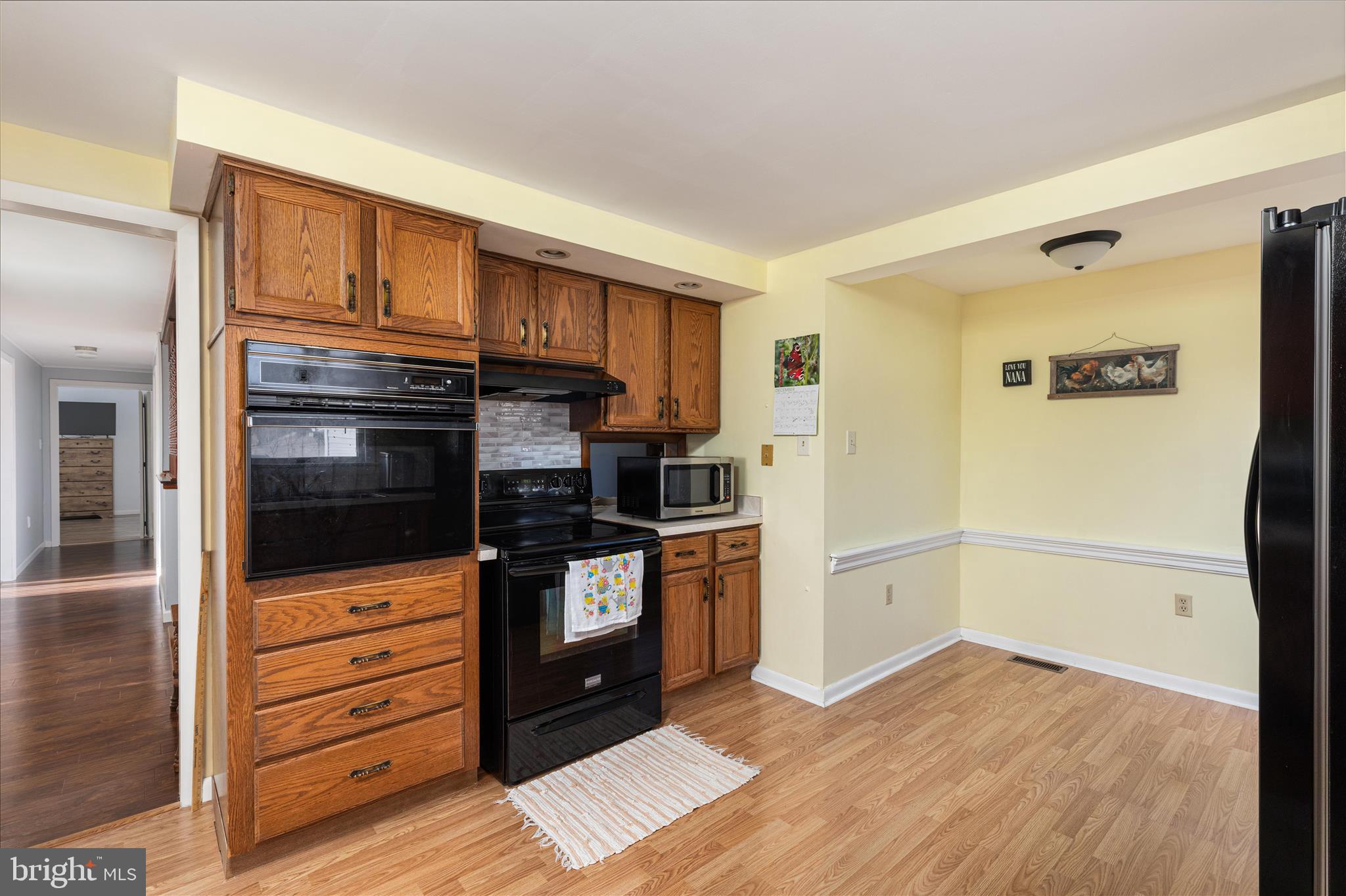 2467 Buck Hill Road Mount Jackson, VA 22842 - Photo 14 of 45 a kitchen with granite countertop a refrigerator and a stove top oven