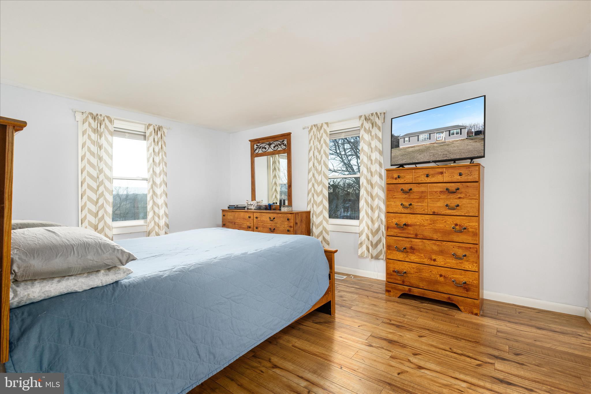 2467 Buck Hill Road Mount Jackson, VA 22842 - Photo 21 of 45 a bedroom with a bed and a dresser