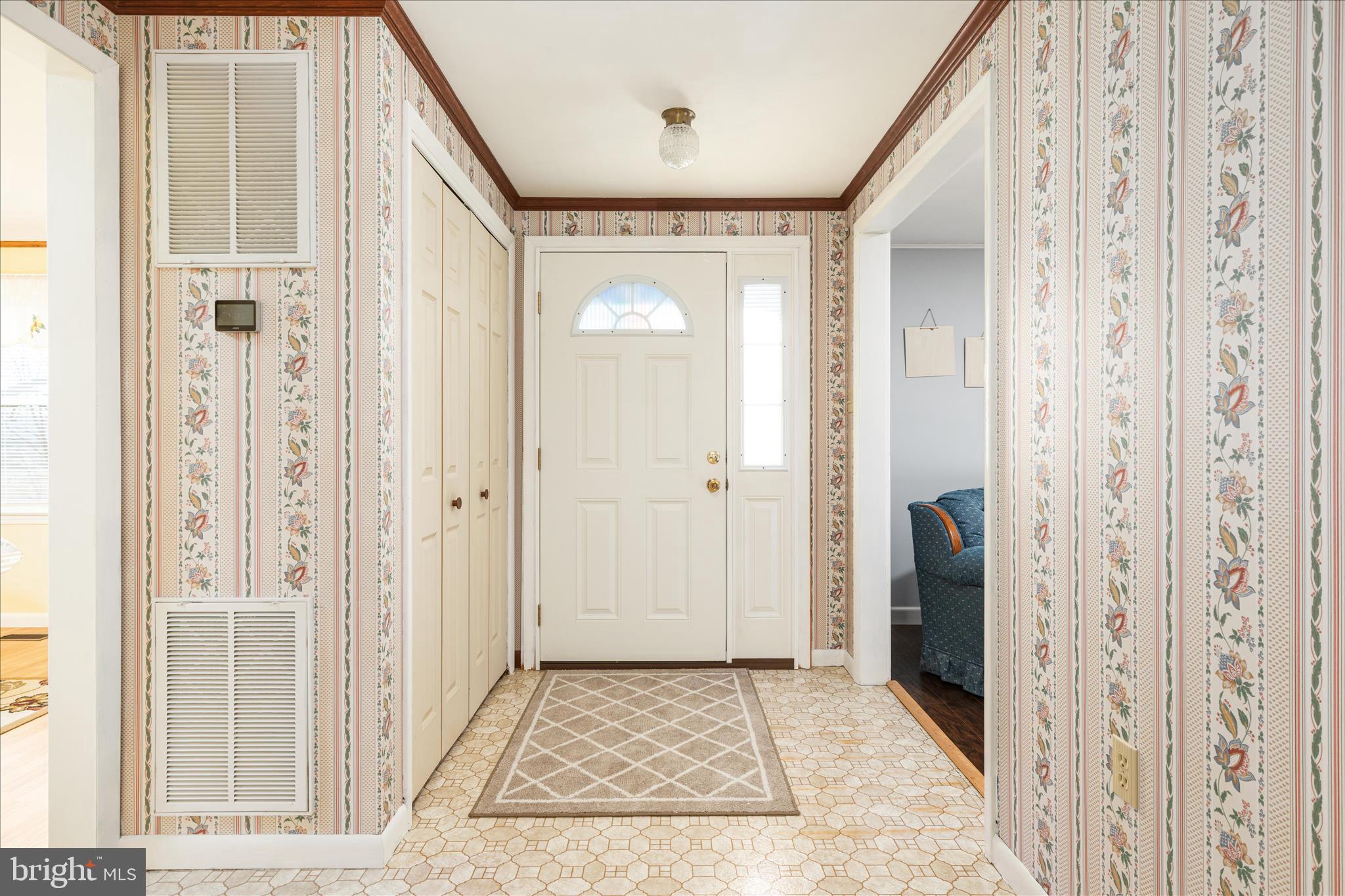 2467 Buck Hill Road Mount Jackson, VA 22842 - Photo 5 of 45 a view of a hallway with wooden floor and a living room