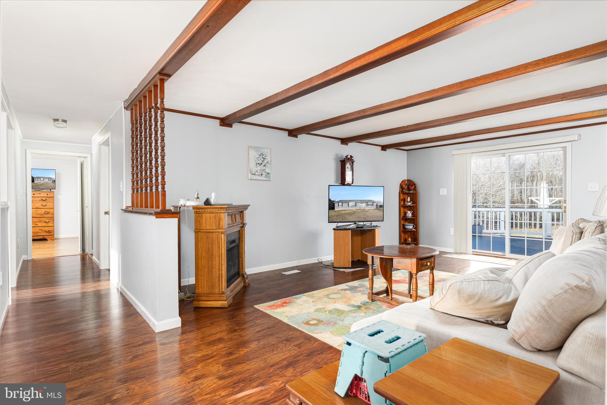 2467 Buck Hill Road Mount Jackson, VA 22842 - Photo 8 of 45 a living room with furniture a fireplace and wooden floor