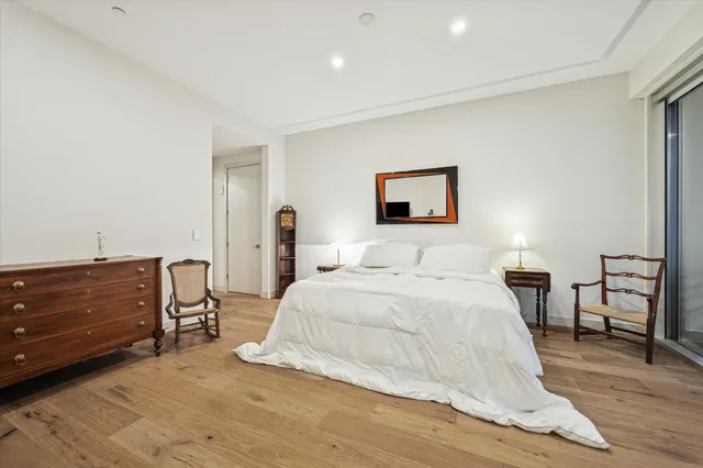 a bedroom with a bed and a table