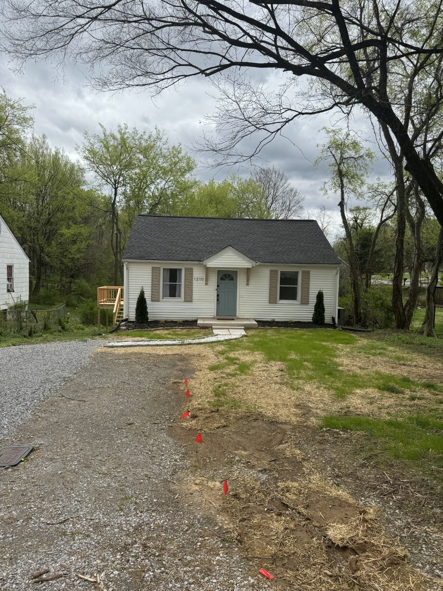 1210 Daniel Street Clarksville, TN 37040 - Photo 1 of 5 a front view of a house with a garden