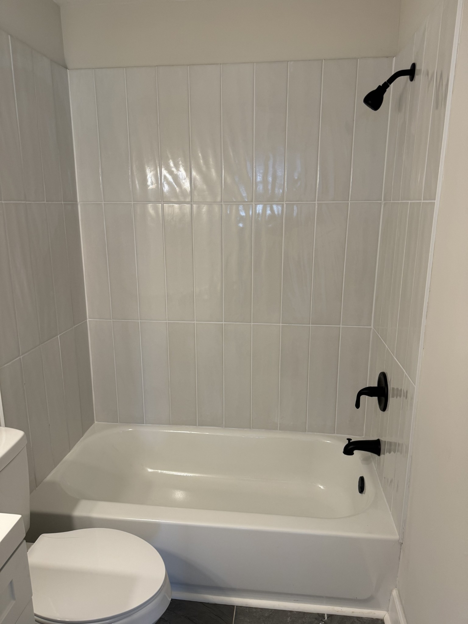 1210 Daniel Street Clarksville, TN 37040 - Photo 5 of 5 a bathroom with a toilet and a bathtub