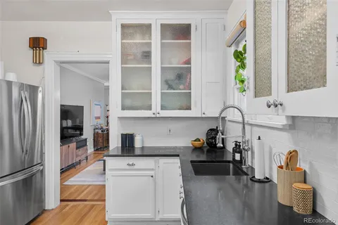 a kitchen with a refrigerator and window