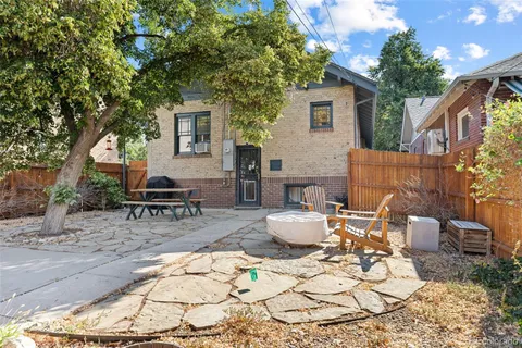 a backyard of a house with seating space
