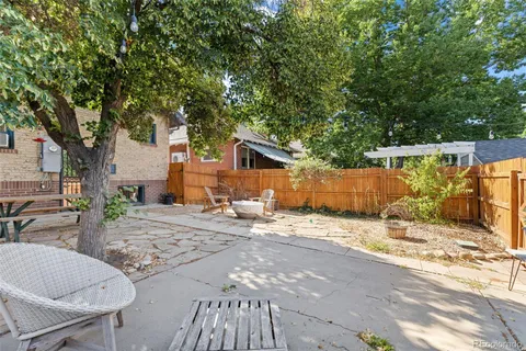 a view of a backyard with sitting area