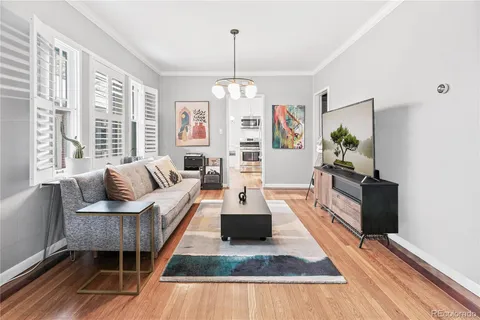 a living room with furniture fireplace and flat screen tv