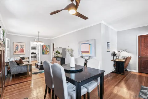 a living room with furniture a rug and a chandelier