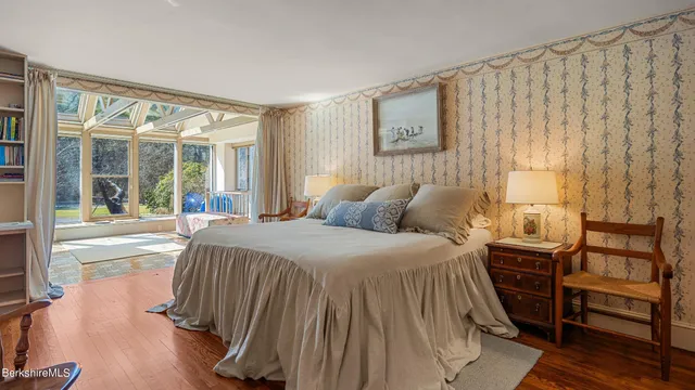 a view of an empty room with large windows