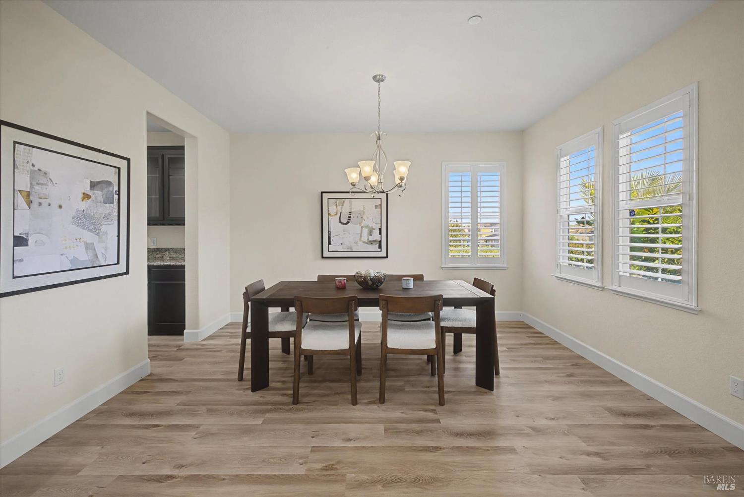 685 Elderberry Loop Vacaville, CA 95688 - Photo 13 of 73 a view of a dining room with furniture window and wooden floor