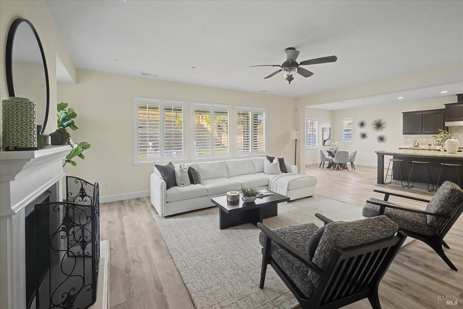685 Elderberry Loop Vacaville, CA 95688 - Photo 18 of 73 a living room with furniture a fireplace and a flat screen tv
