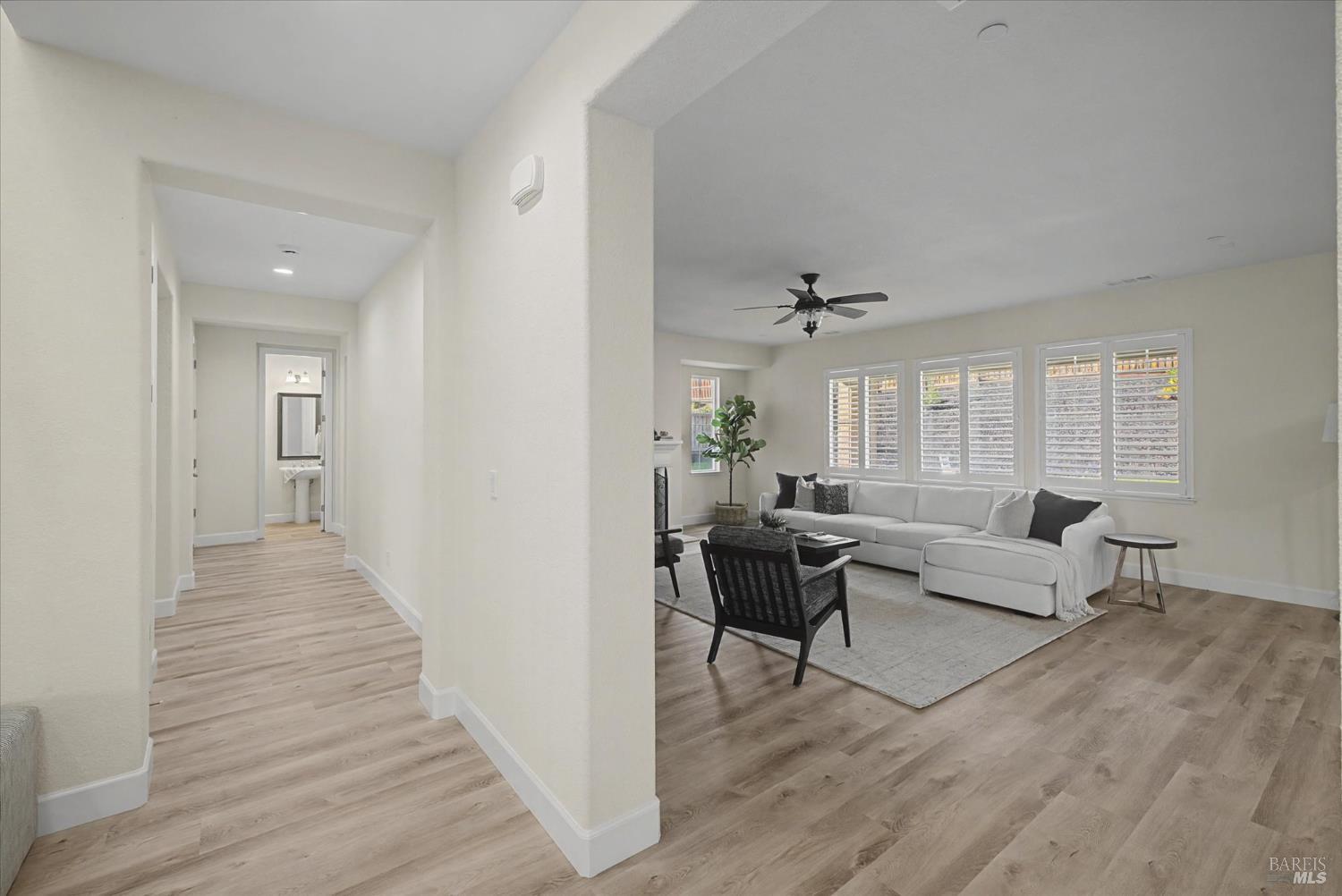 685 Elderberry Loop Vacaville, CA 95688 - Photo 27 of 73 a living room with furniture and a wooden floor