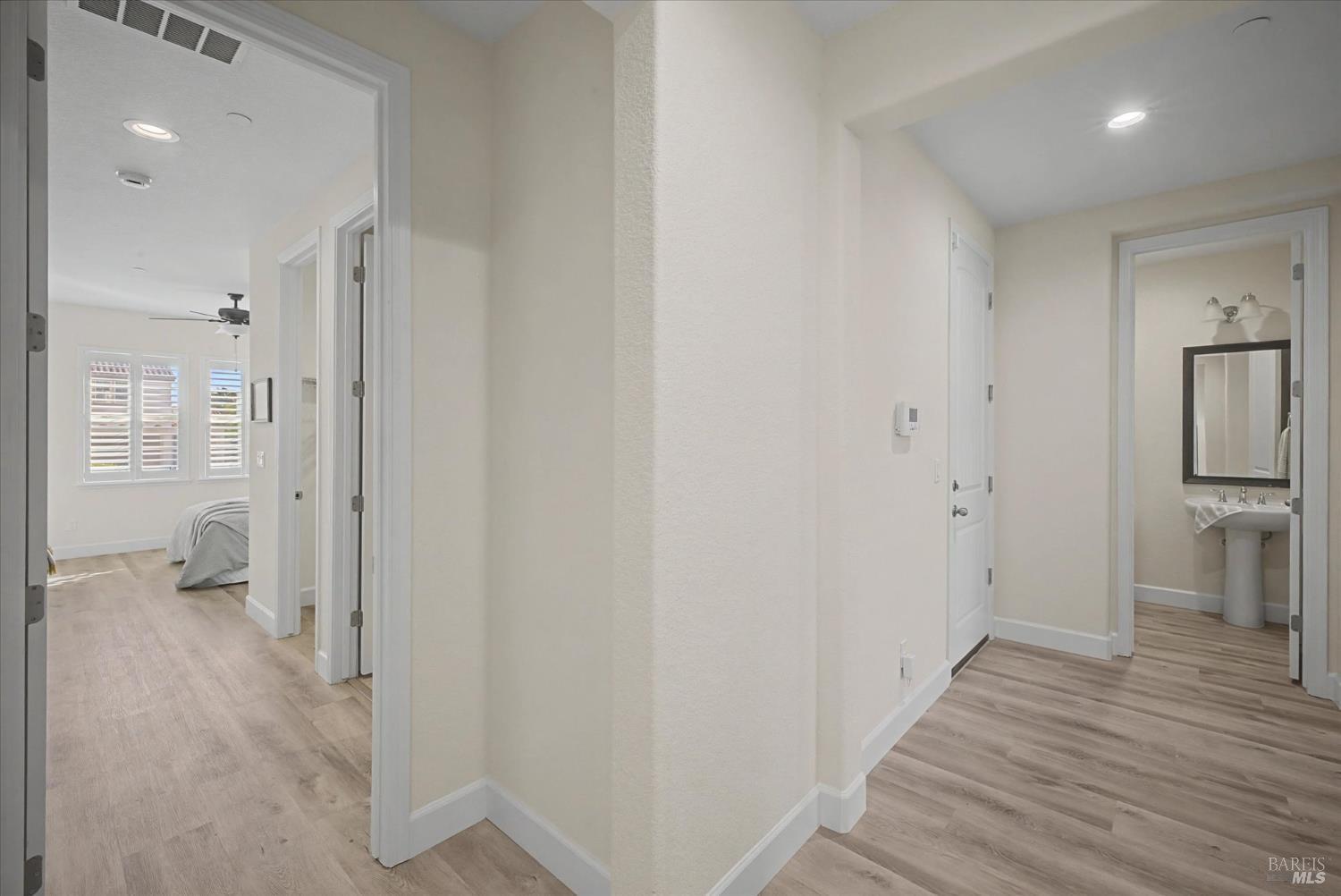 685 Elderberry Loop Vacaville, CA 95688 - Photo 28 of 73 a view of a room with wooden floor and a bathroom
