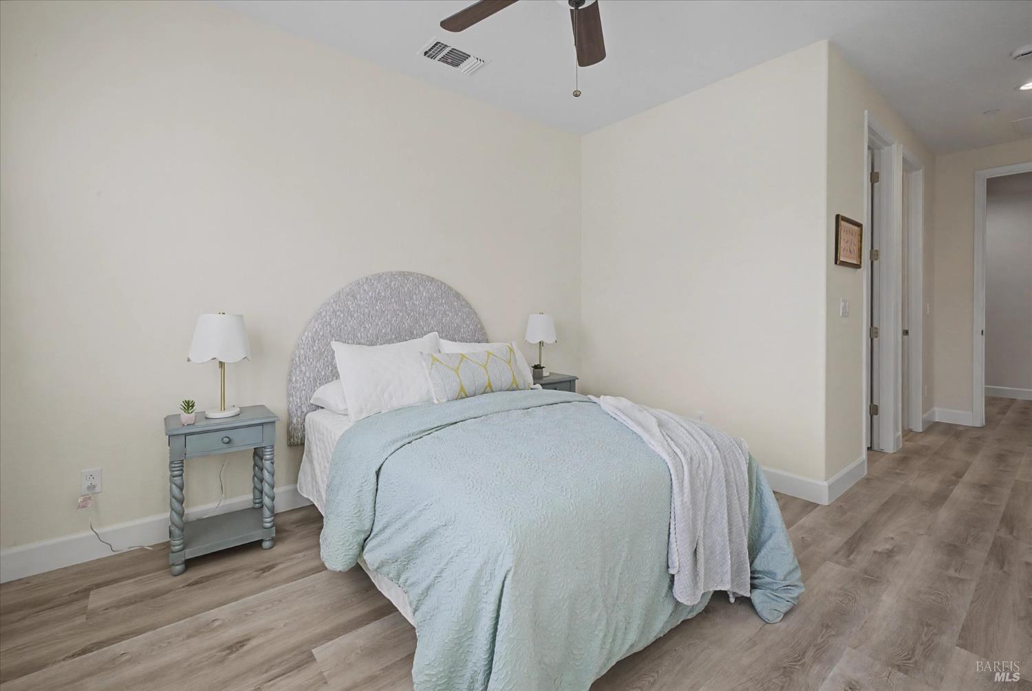 685 Elderberry Loop Vacaville, CA 95688 - Photo 33 of 73 a bedroom with a bed and a table