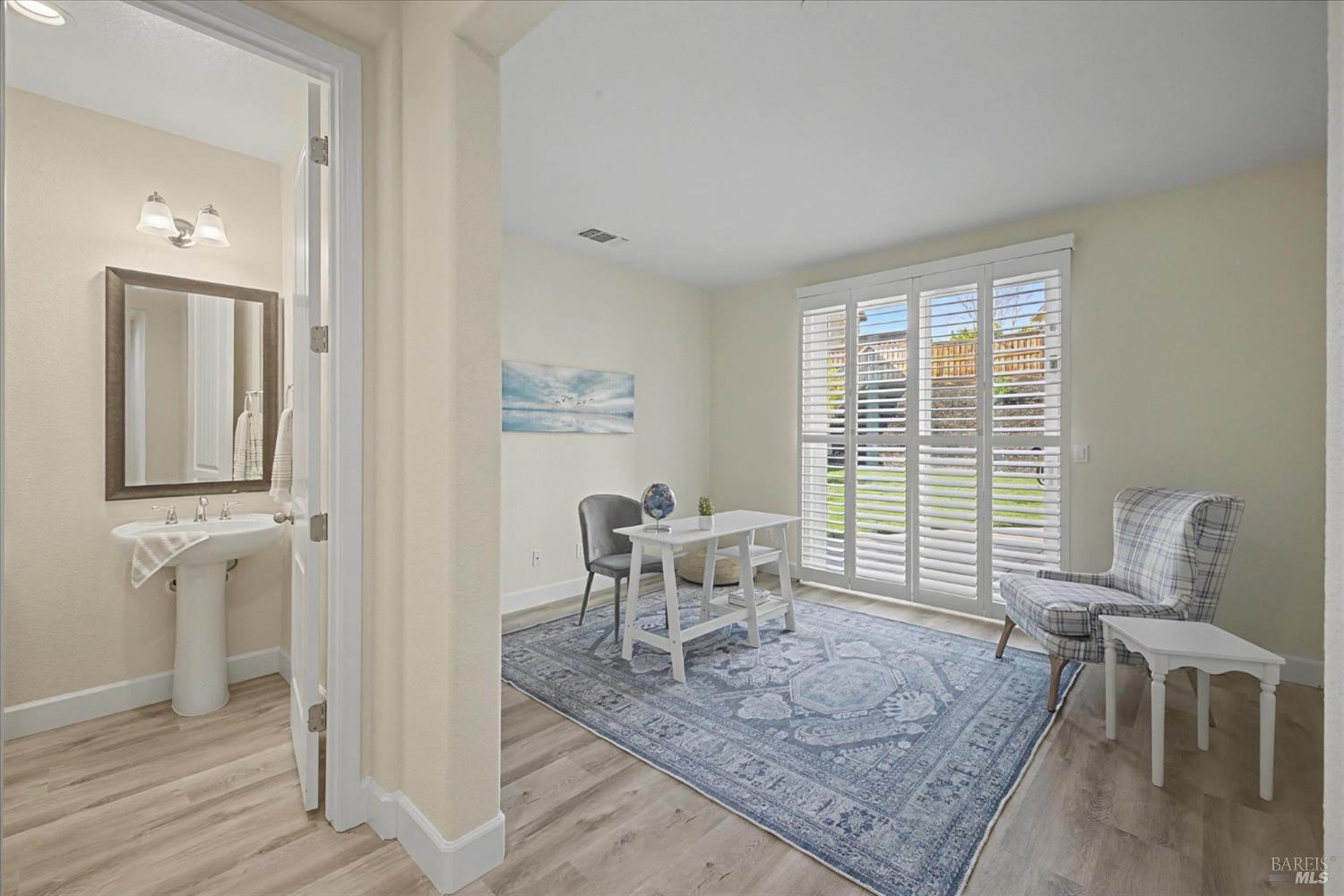 685 Elderberry Loop Vacaville, CA 95688 - Photo 34 of 73 a view of a dining room with furniture and wooden floor