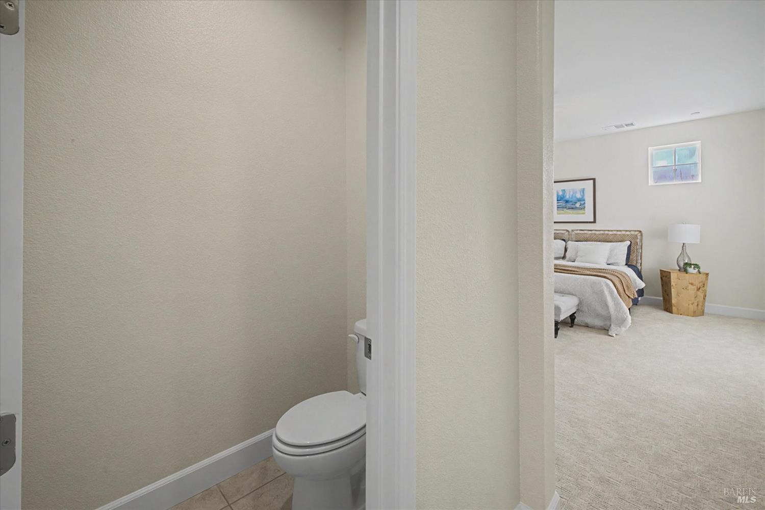 685 Elderberry Loop Vacaville, CA 95688 - Photo 48 of 73 a bathroom with a toilet and a sink