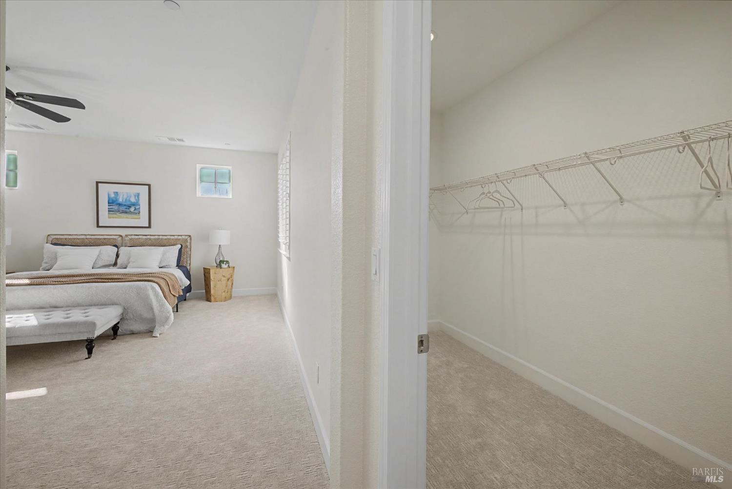 685 Elderberry Loop Vacaville, CA 95688 - Photo 49 of 73 a spacious bedroom with a bed and a couch