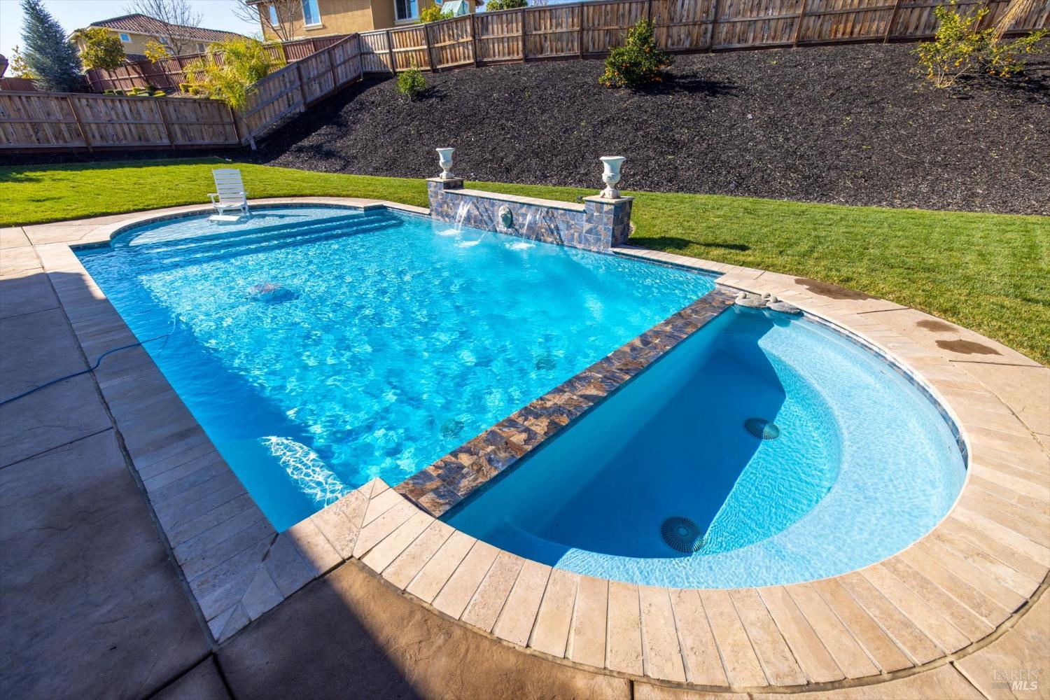 685 Elderberry Loop Vacaville, CA 95688 - Photo 60 of 73 a view of a swimming pool with a yard