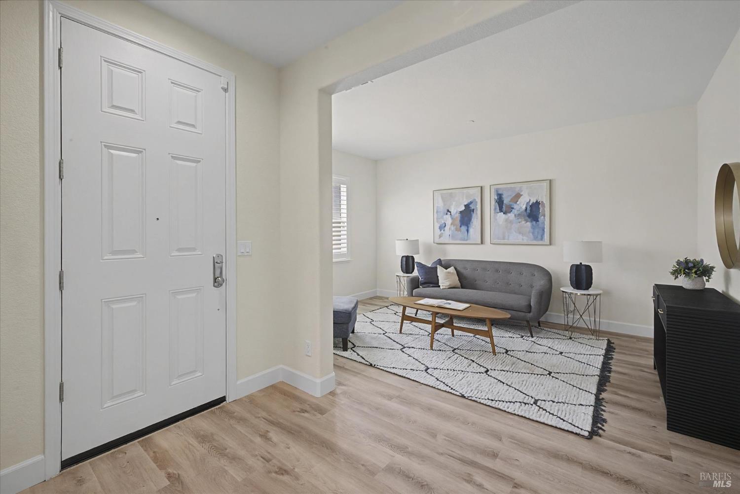 685 Elderberry Loop Vacaville, CA 95688 - Photo 7 of 73 a living room with furniture a rug and painting on the wall