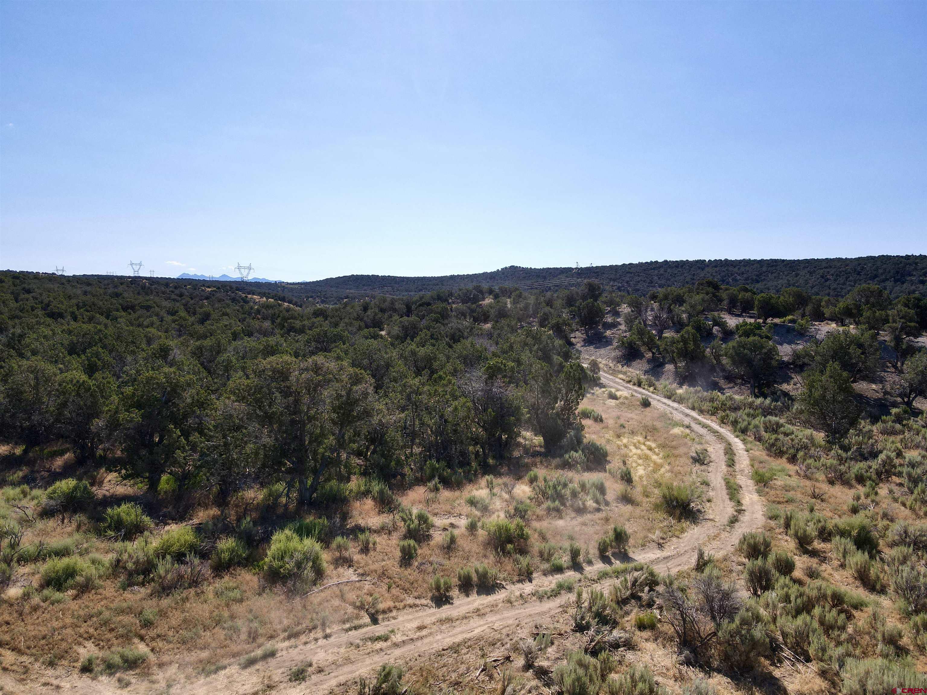 Tbd Rd L Mancos, CO 81328 - Photo 21 of 24 a view of a dry field with mountains in the background