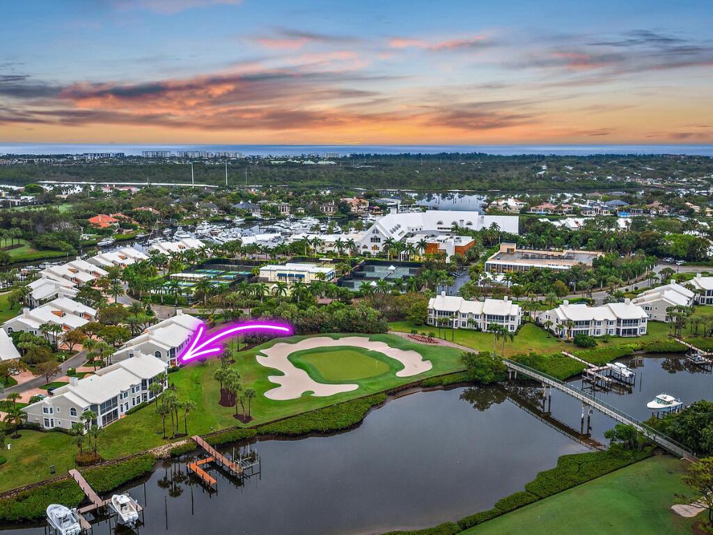 1504 Captains Way Jupiter, FL 33477 - Photo 2 of 51 an aerial view of residential houses with outdoor space and trees