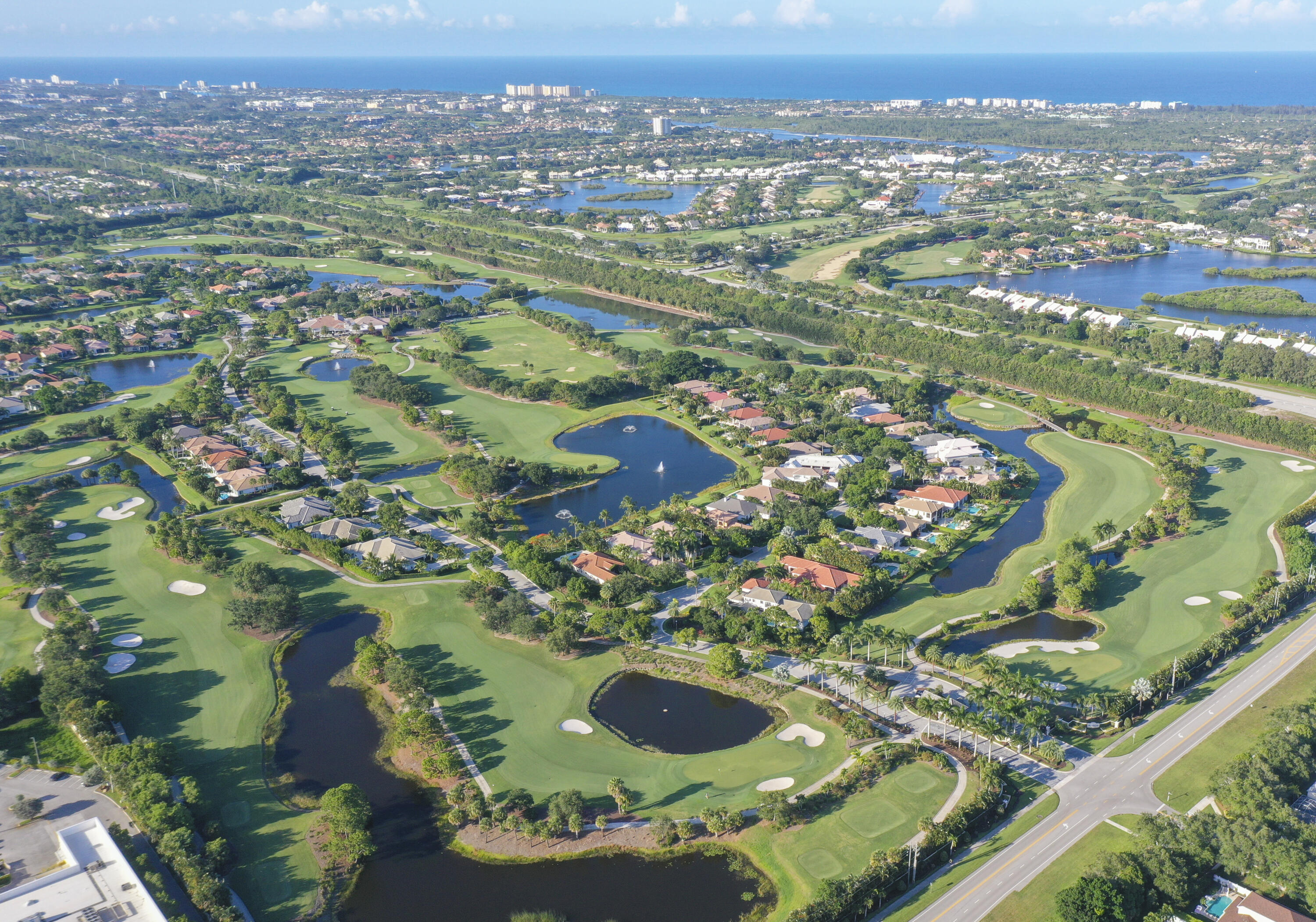 1504 Captains Way Jupiter, FL 33477 - Photo 50 of 51 an aerial view of residential houses with outdoor space and trees