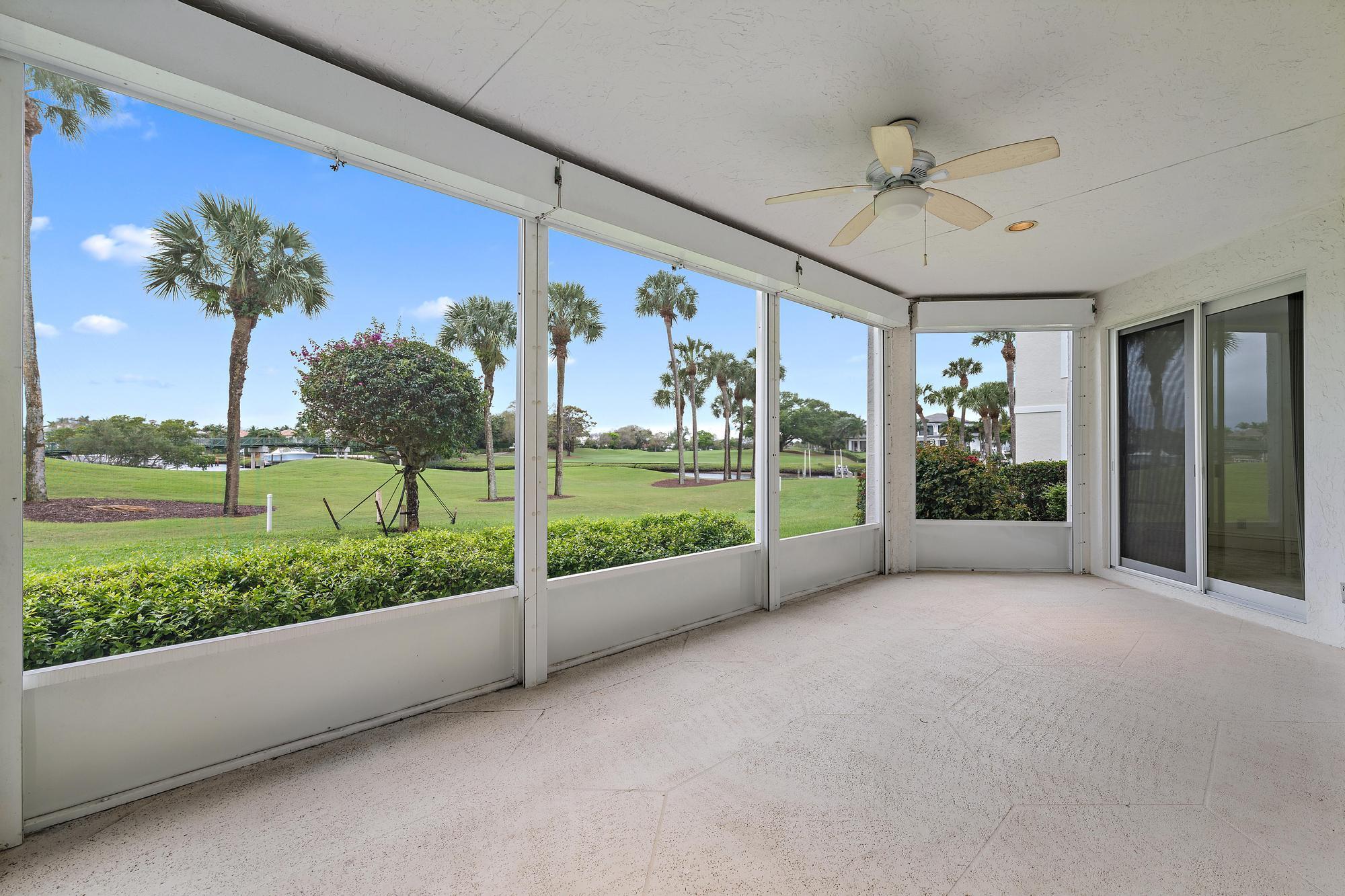 1504 Captains Way Jupiter, FL 33477 - Photo 10 of 51 a view of a porch with furniture and garden