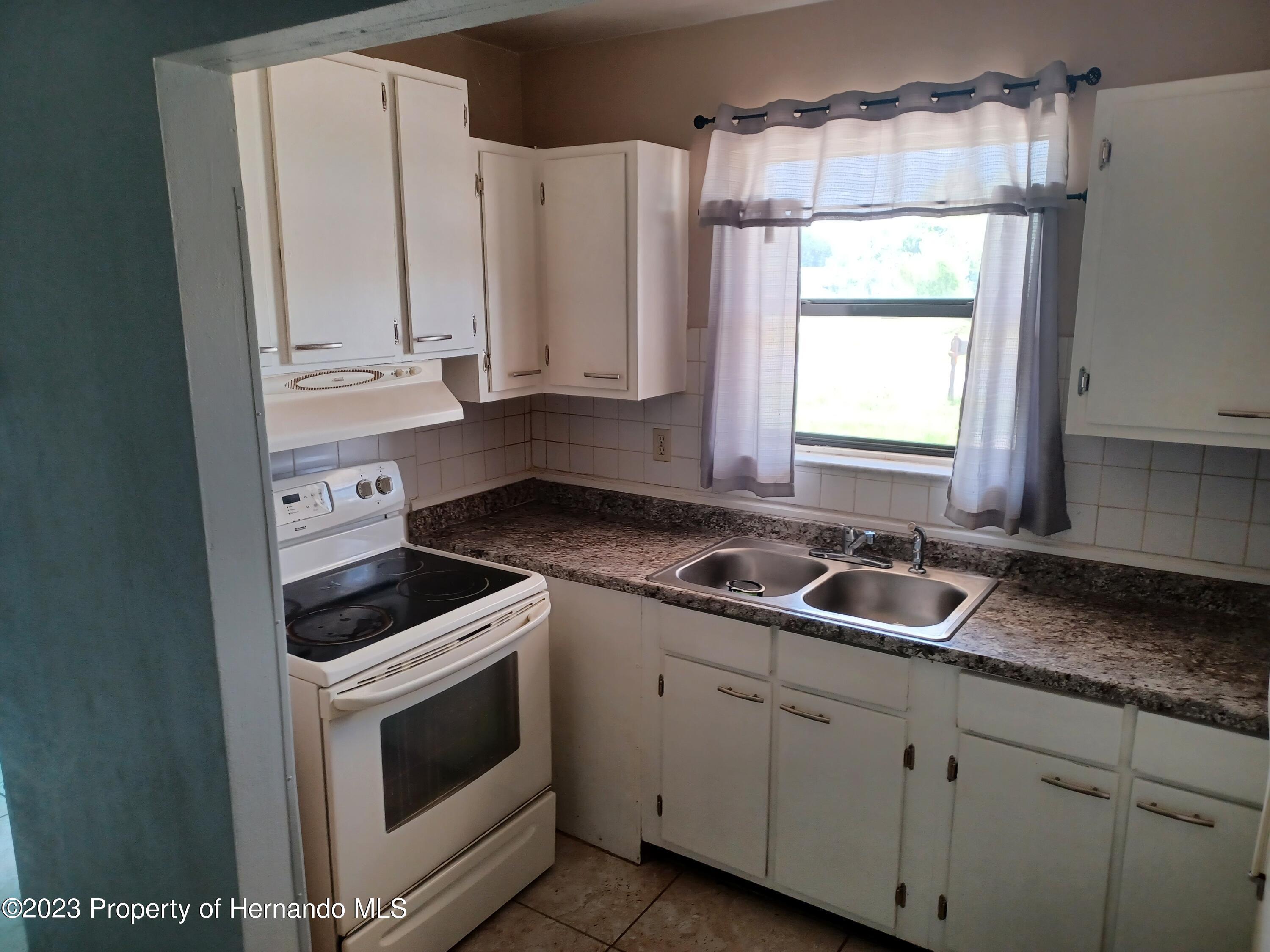 595 Swallow Lane Spring Hill, FL 34606 - Photo 4 of 24 20230721_124531