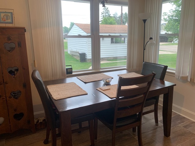 703 North 12th Street Rochelle, IL 61068 - Photo 14 of 37 a view of a dining room with a table and chairs
