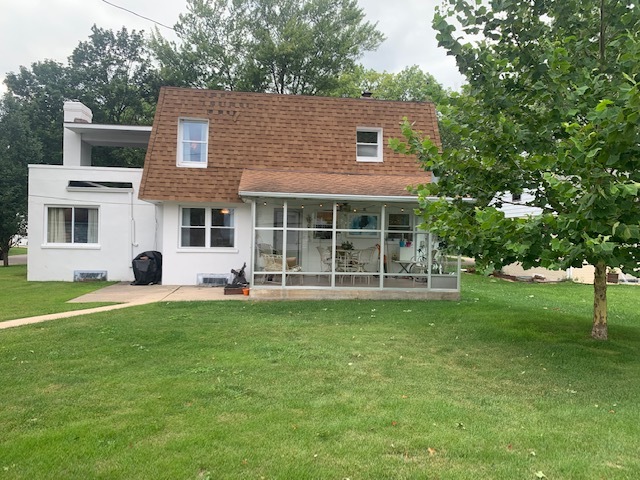 703 North 12th Street Rochelle, IL 61068 - Photo 3 of 37 a view of a house with a yard