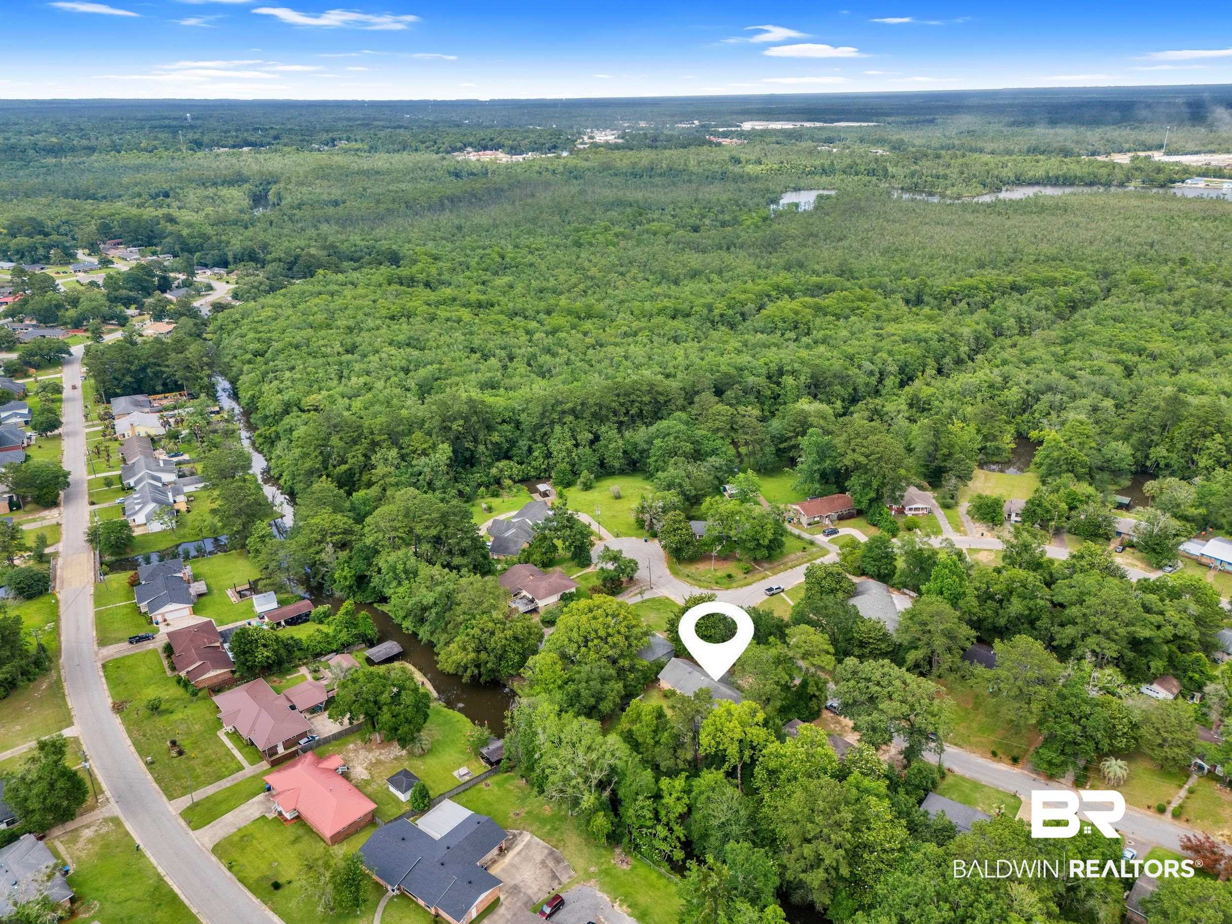 224 Cache Circle Mobile, AL 36611 - Photo 33 of 42 Aerial overview of property's location with a heavily wooded area and nearby suburban area