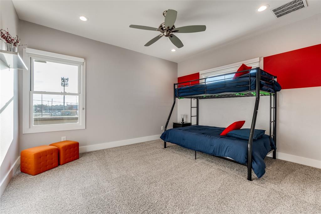 7912 Hanover Street Dallas, TX 75225 - Photo 11 of 29 Carpeted kid's room featuring a ceiling fan with integrated lighting, recessed ceiling lights, and an accent wall with red paneling