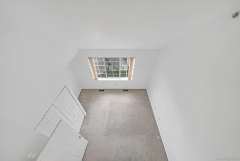 an entryway of a room with windows