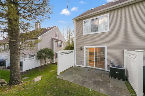 a view of a house with a yard and garage