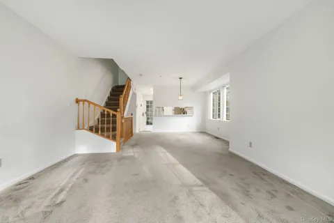 a view of a hallway with stairs