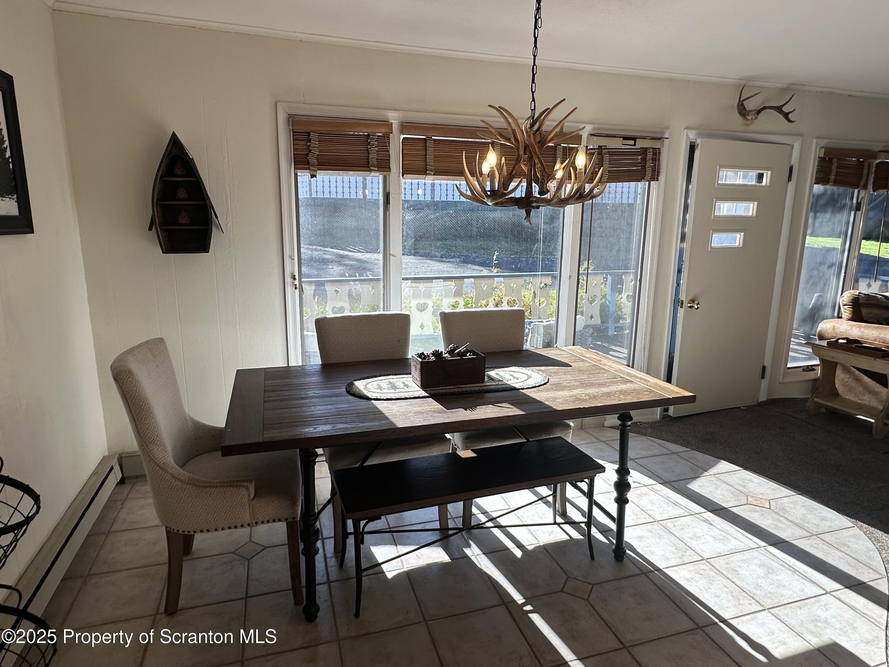 25 Fall Place Union Dale, PA 18470 - Photo 11 of 27 a view of a dining room with furniture and window