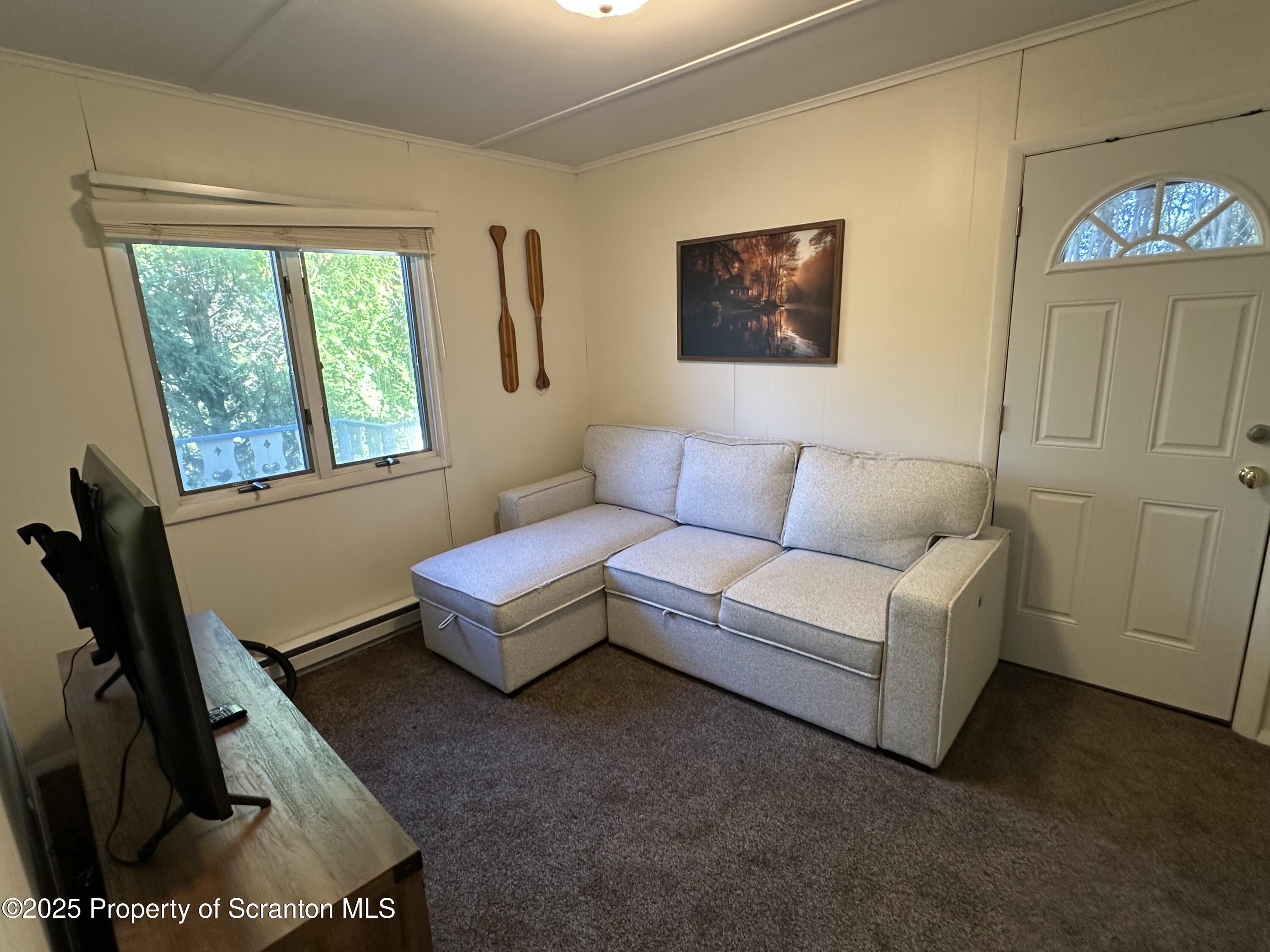 25 Fall Place Union Dale, PA 18470 - Photo 14 of 27 a living room with furniture and a window