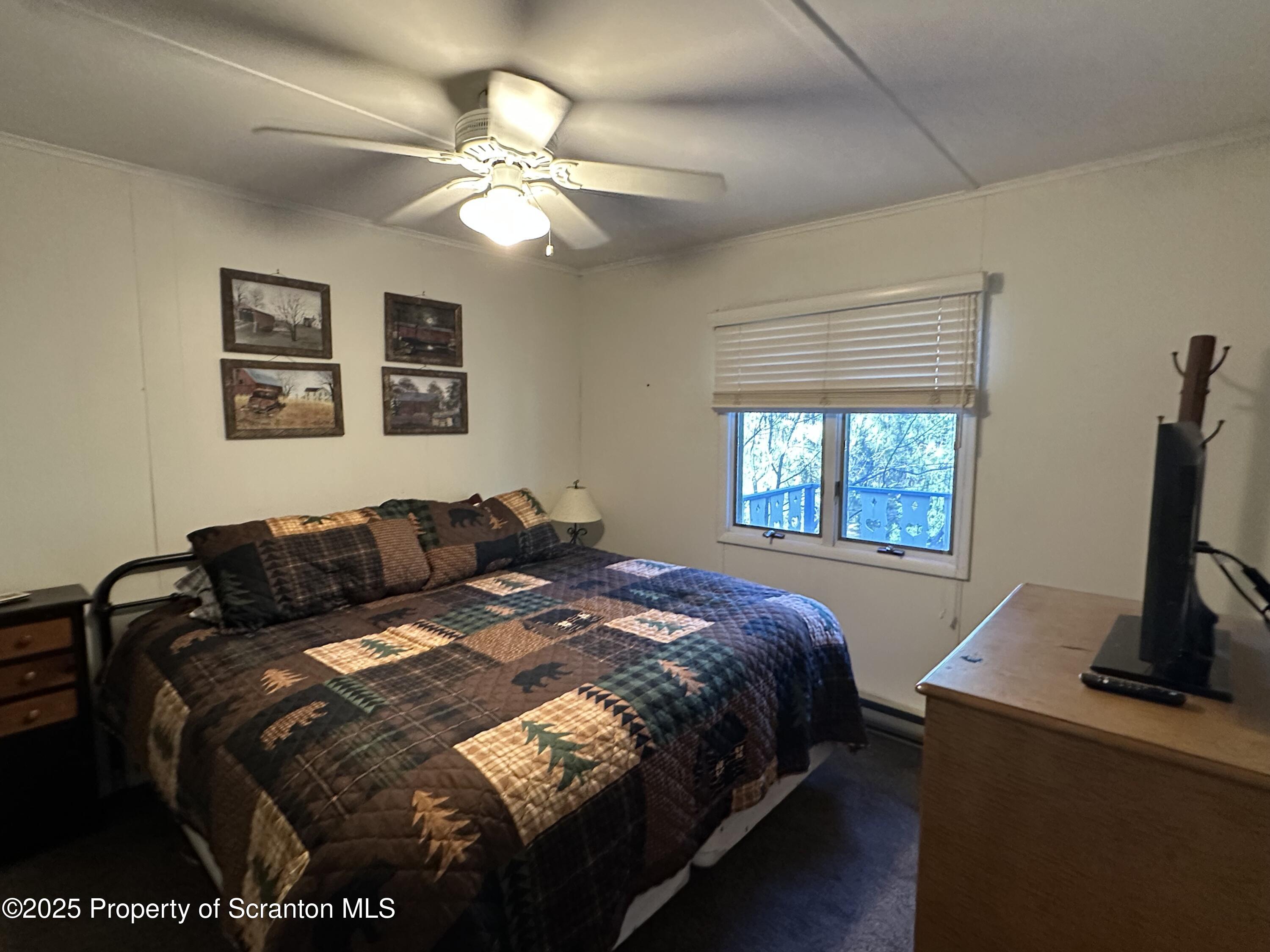 25 Fall Place Union Dale, PA 18470 - Photo 16 of 27 a bed sitting in a bedroom next to a window