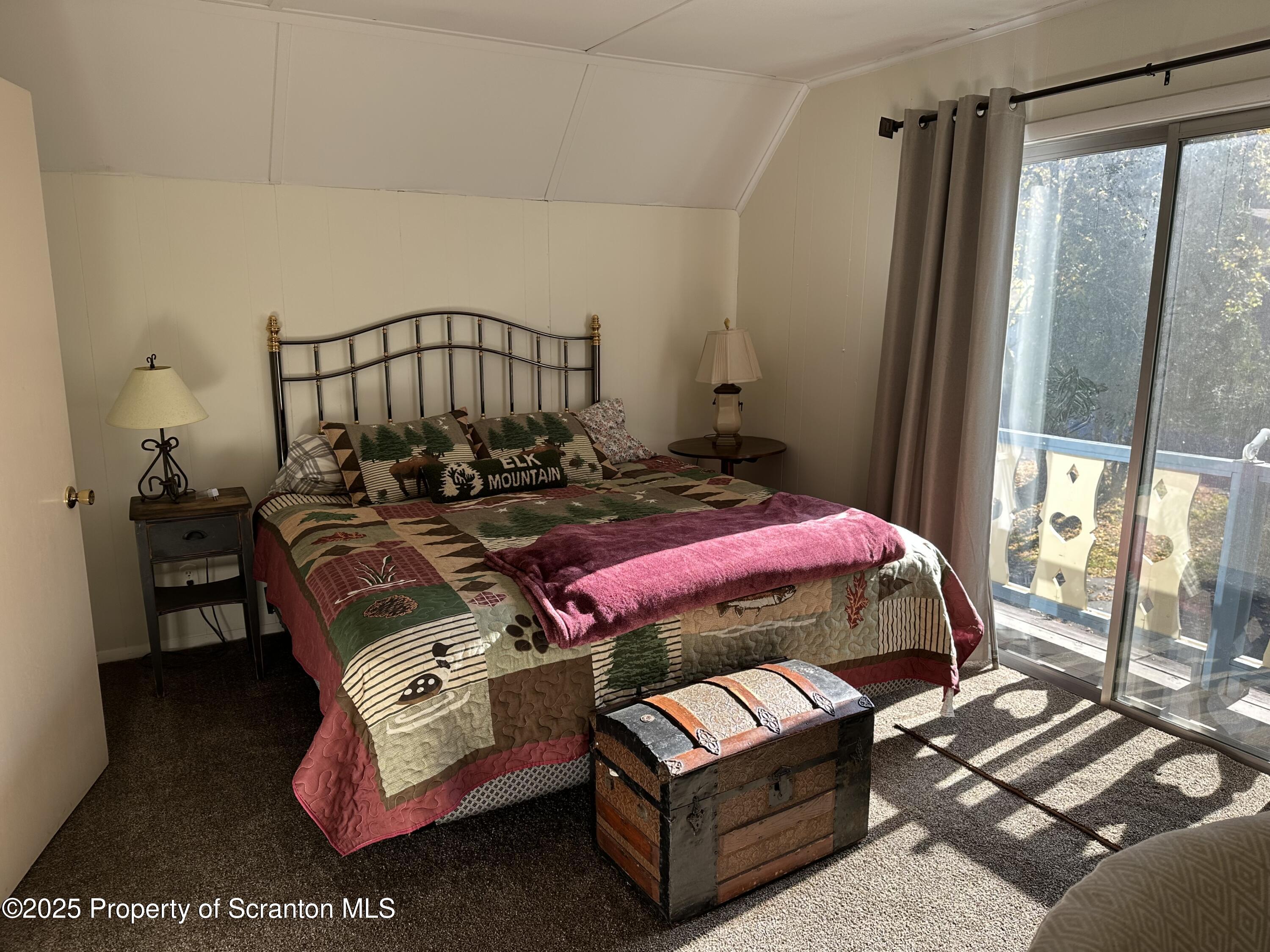 25 Fall Place Union Dale, PA 18470 - Photo 18 of 27 a bedroom with a bed next to a window