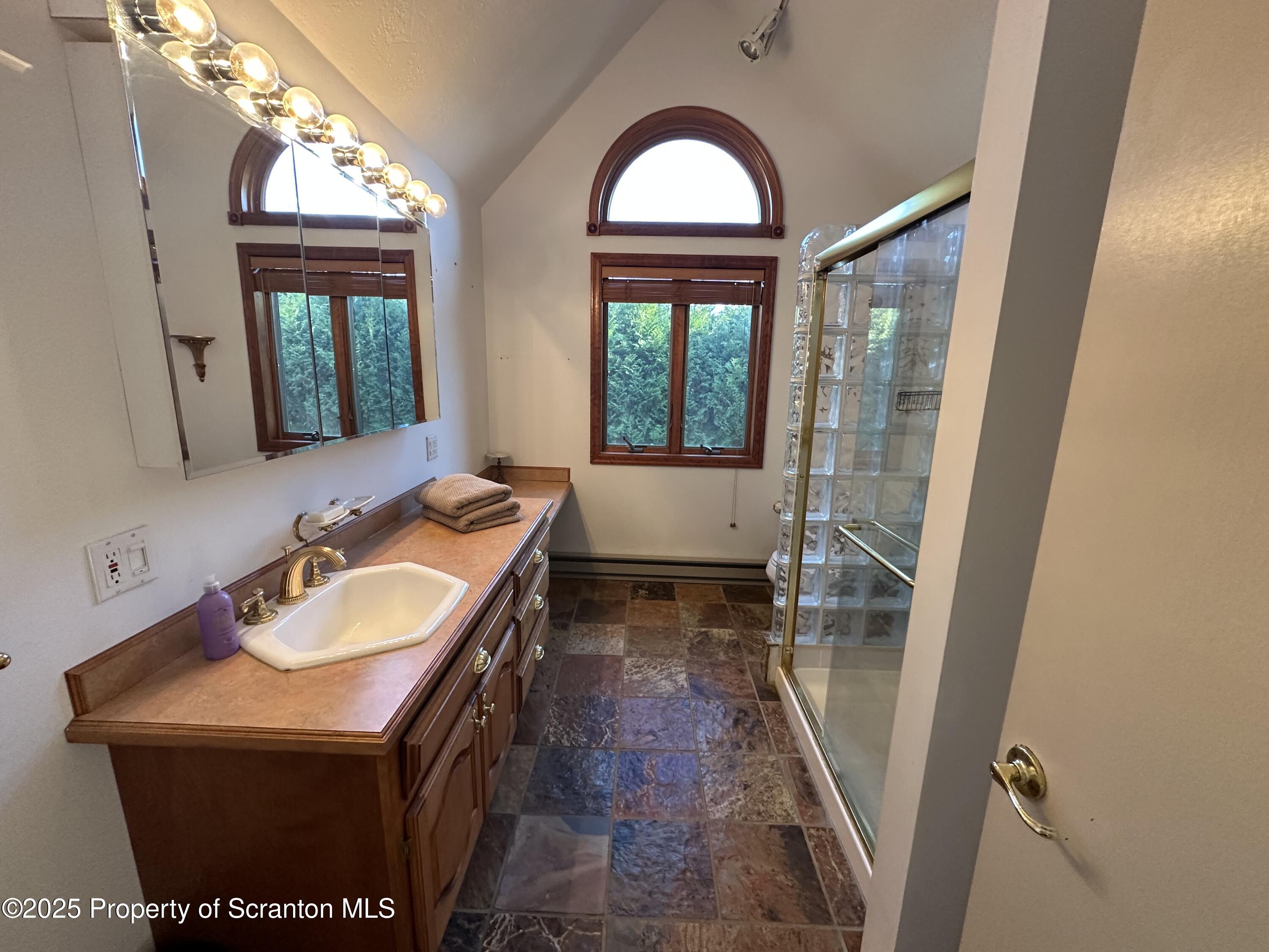 25 Fall Place Union Dale, PA 18470 - Photo 21 of 27 a bathroom with a sink a vanity and a mirror