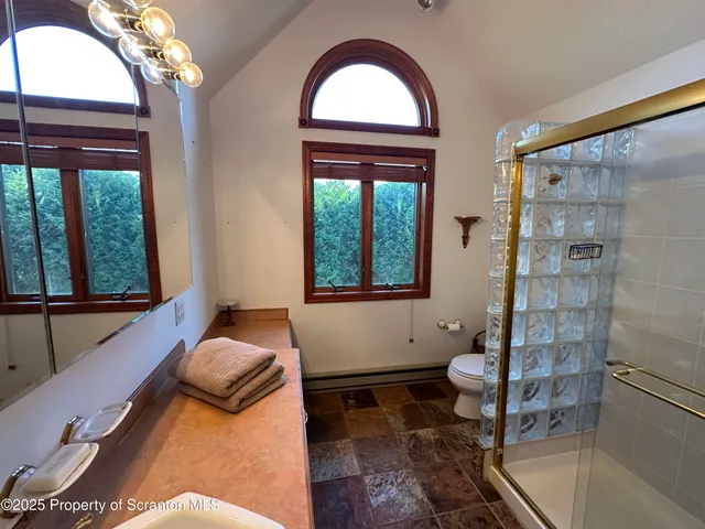 a bedroom with double bed and a window