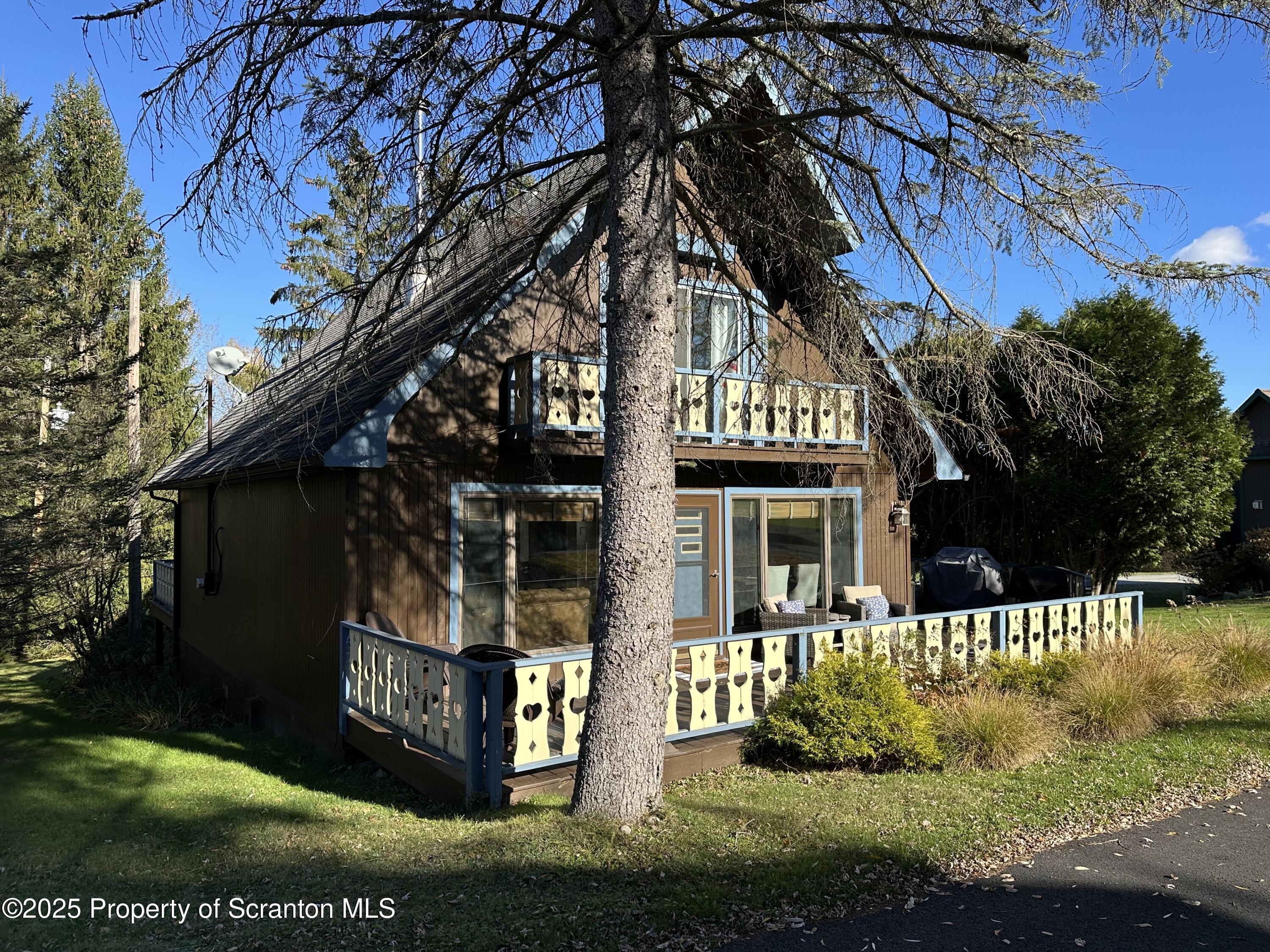 25 Fall Place Union Dale, PA 18470 - Photo 3 of 27 a front view of a house with a yard