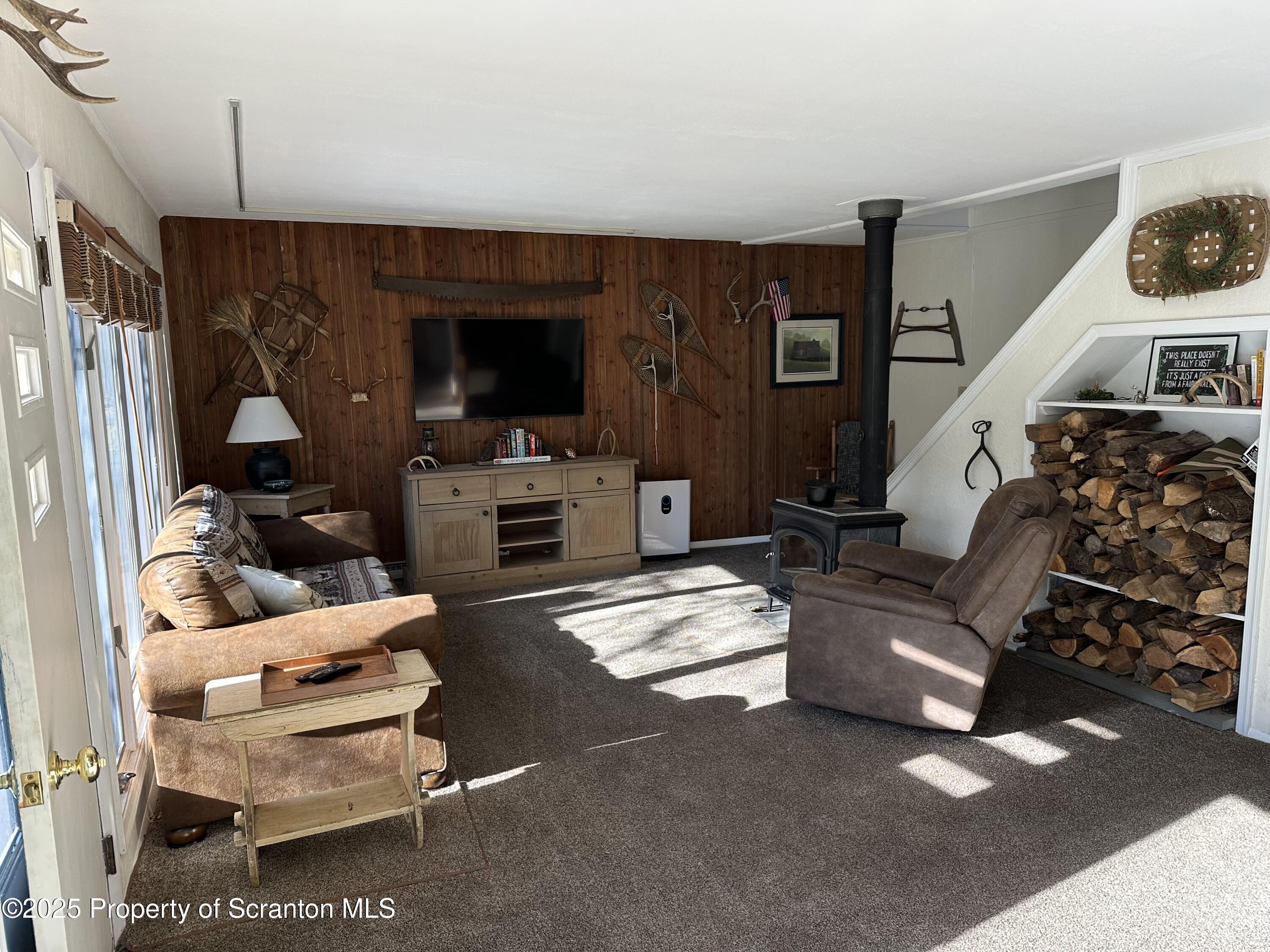 25 Fall Place Union Dale, PA 18470 - Photo 5 of 27 a living room with furniture and a flat screen tv
